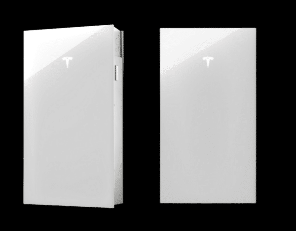 Two white Tesla Powerwall units are shown against a black background, each with the Tesla logo on the front. The left unit is slightly angled, revealing a side view.