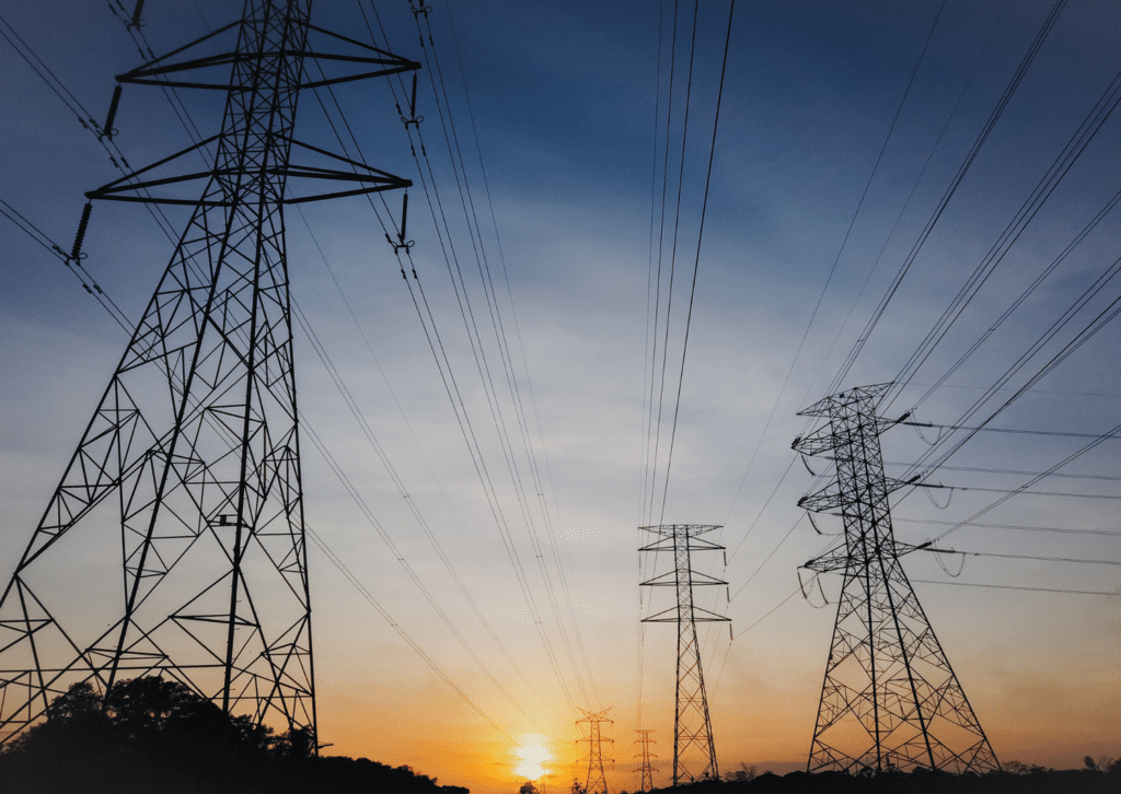 High voltage pylons at sunset.