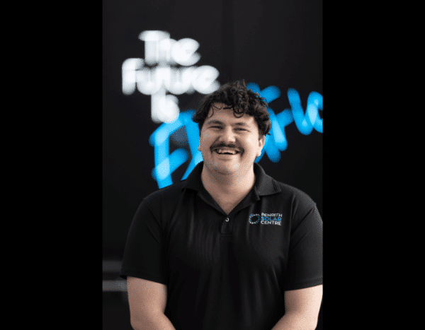 A person wearing a black polo shirt with "Bendith Centre" logo stands in front of a backdrop with the words "The Future is Bright" in white and blue text.