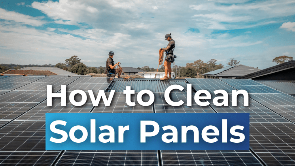 Two people cleaning solar panels on a rooftop under a partly cloudy sky, with text overlay "How to Clean Solar Panels.