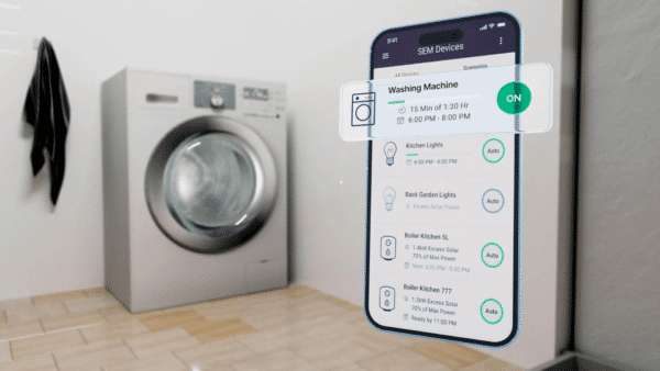 A smartphone screen displays a home automation app controlling a washing machine in a laundry room with beige tiles and a wall-mounted black coat.