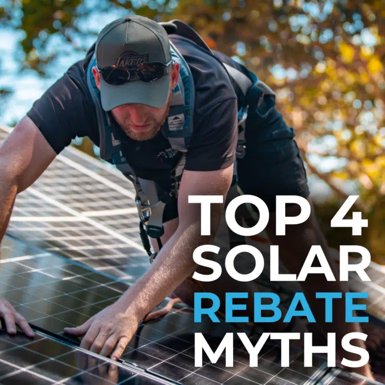 A person in a harness and cap is installing solar panels on a roof. Text on the image reads "Top 4 Solar Rebate Myths.