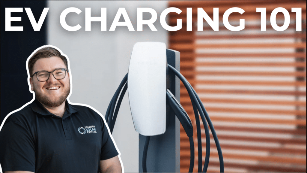 An individual wearing glasses and a polo shirt smiles beside an electric vehicle charging station under the text "EV CHARGING 101".