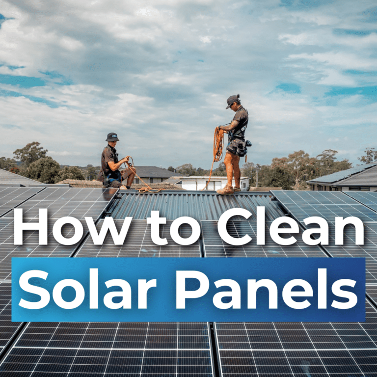 Two people work on cleaning solar panels on a roof under a cloudy sky. Text overlay reads, "How to Clean Solar Panels.