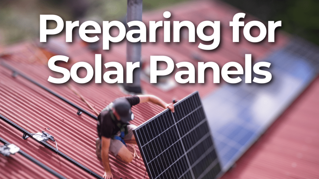 Person installing solar panels on a red roof with a text overlay saying "Preparing for Solar Panels.